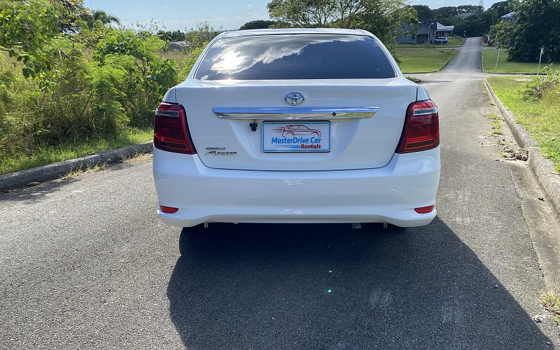 Back image of white toyota camry MasterDrive car rental bridgetown barbados