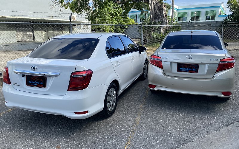 Company information image of two cars in the fleet back view MasterDrive car rental bridgetown barbados