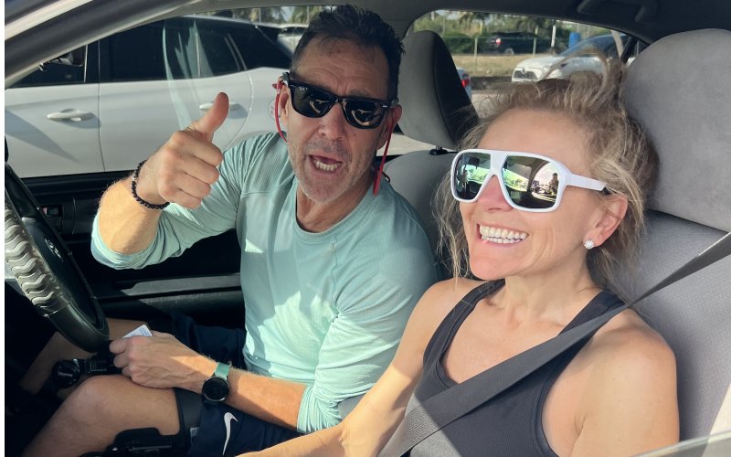 Happy tourists enjoying their MasterDrive rental car during their Barbados vacation.